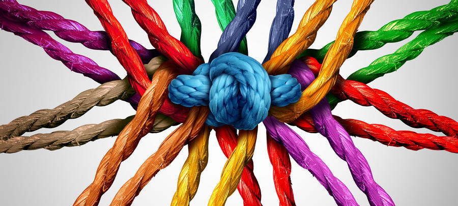 Colorful rope tied together in a knot in the center evoking collaboration